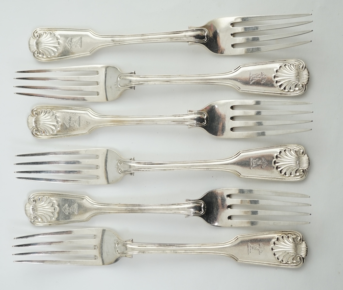 A set of six Victorian silver fiddle, thread and shell pattern table forks, by Henry John Lias and James Wakely